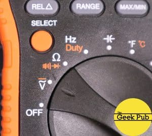 selecting voltage AC/DC on a multimeter