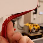 Notching T-molding wall mount arcade